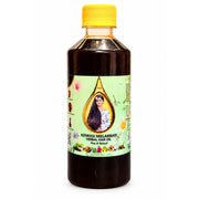 A bottle of Adivasi Neelambari Herbal Hair Oil with a yellow cap and a light green label, shown on a plain white background.