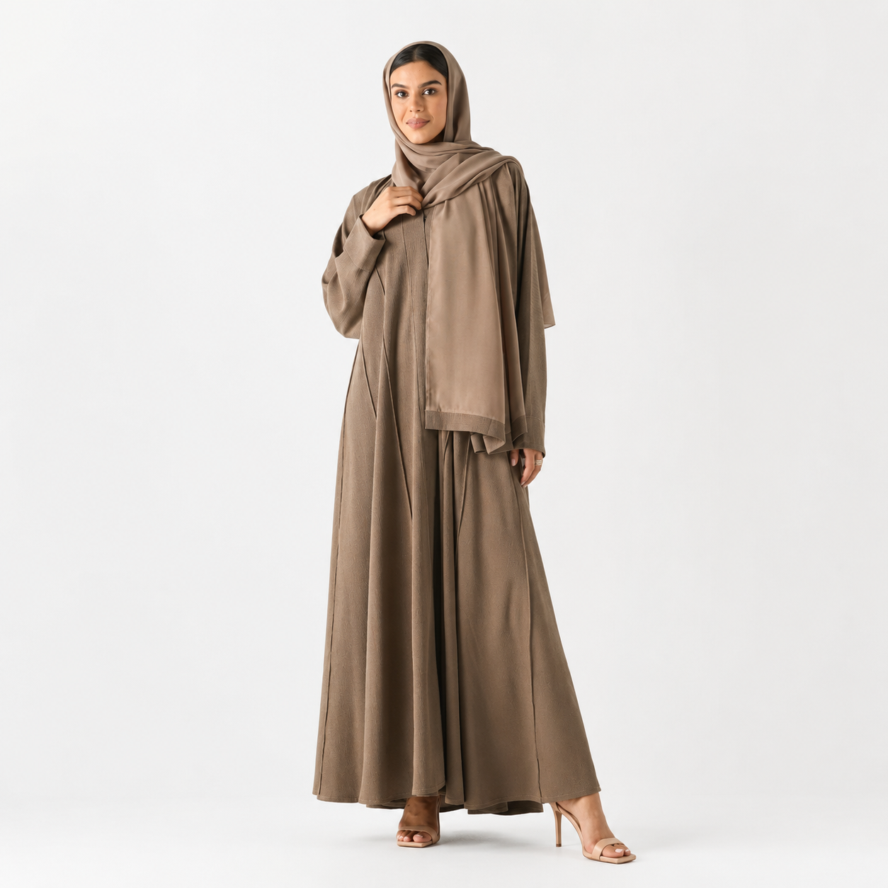 Beige abaya styled for daily and evening wear