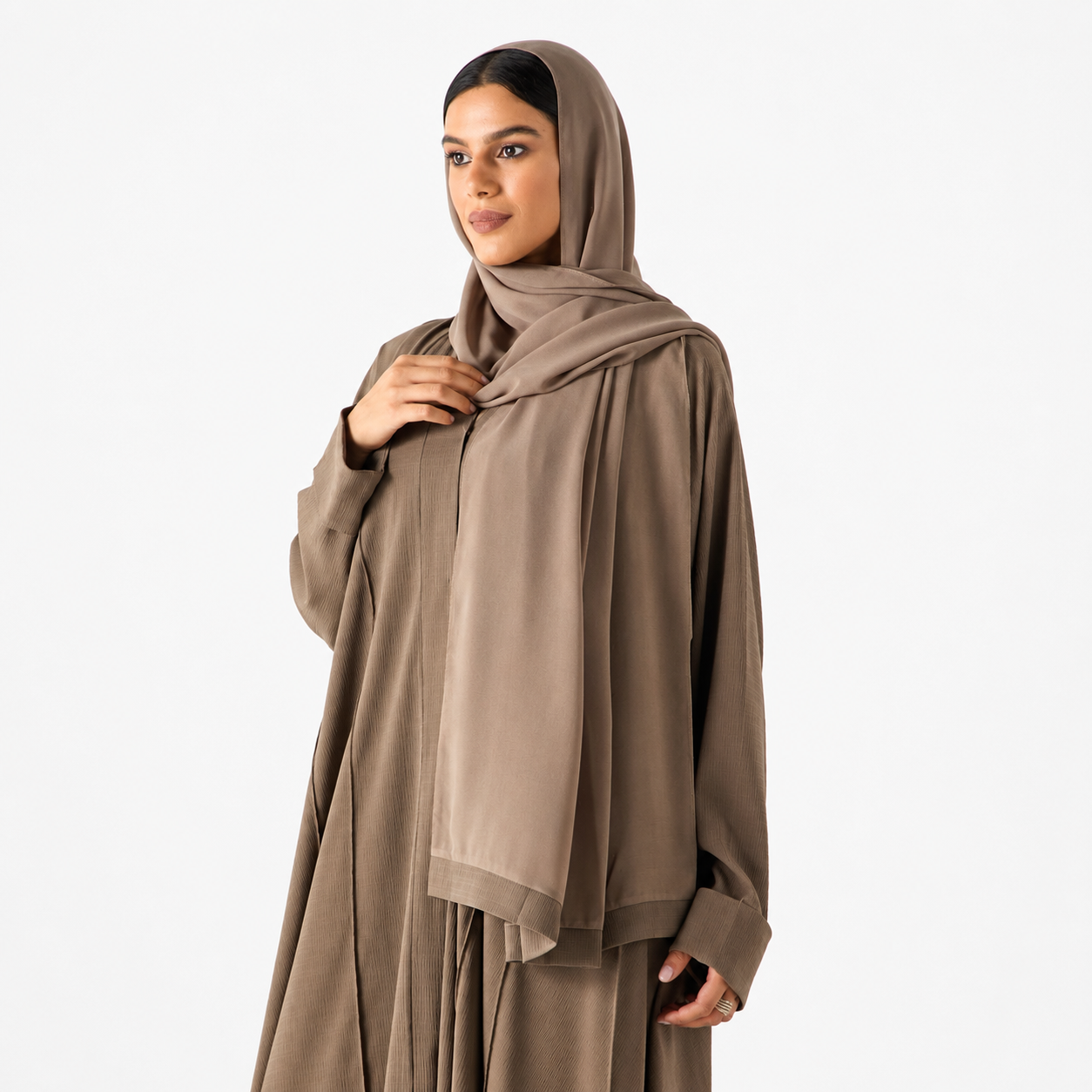 Side view of beige long sleeve flowing abaya