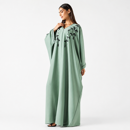 Side view of sage green bisht abaya with flowing silhouette